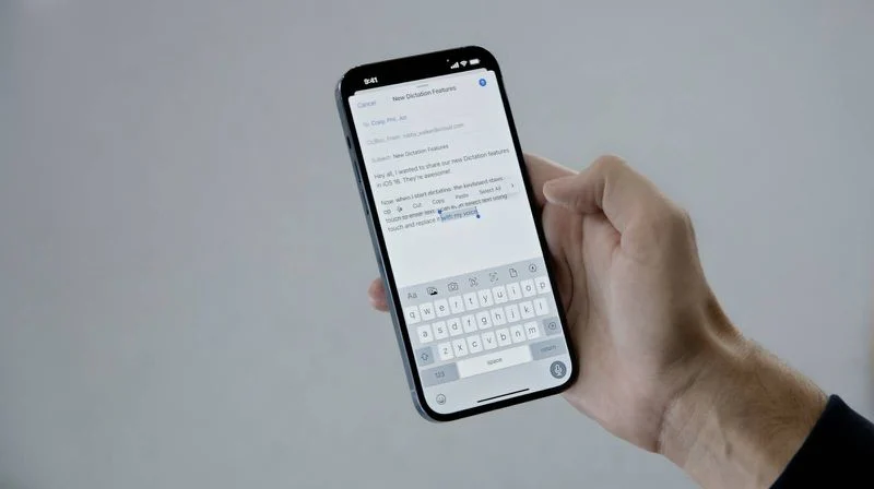 A hand holding a phone with a voice assistant open
